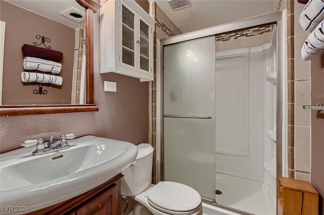 6213 Fairwood Ave, Las Vegas, NV 89107 - full bathroom with a shower stall, vanity, and a textured wall