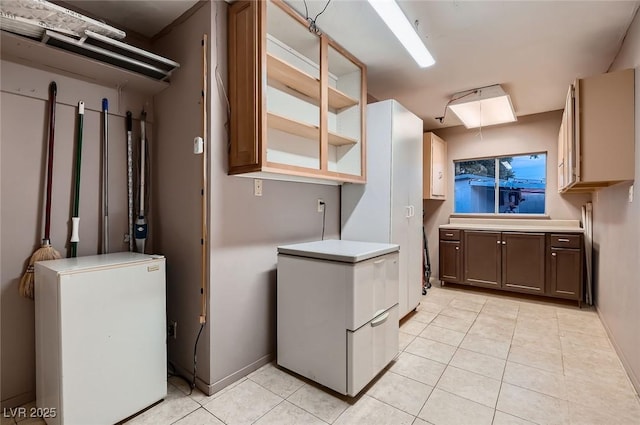 6213 Fairwood Ave, Las Vegas, NV 89107 - washroom with light tile patterned floors and baseboards
