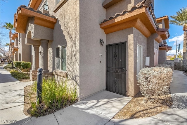 7701 W Robindale Rd Unit 274, Las Vegas, NV 89113 - view of exterior entry with stucco siding