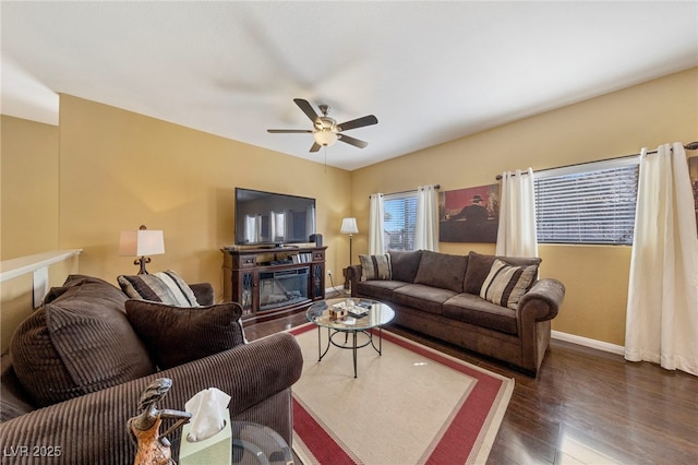 7701 W Robindale Rd Unit 274, Las Vegas, NV 89113 - living area featuring wood finished floors, a ceiling fan, and a glass covered fireplace