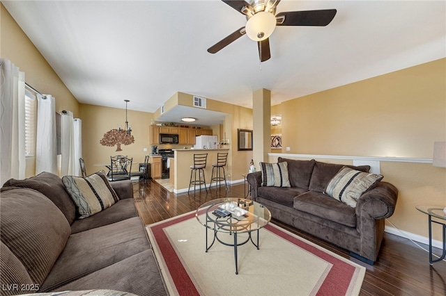 7701 W Robindale Rd Unit 274, Las Vegas, NV 89113 - living area featuring dark wood-style floors and a ceiling fan