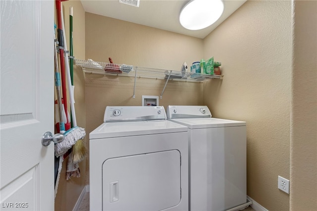 7701 W Robindale Rd Unit 274, Las Vegas, NV 89113 - laundry area with separate washer and dryer and baseboards