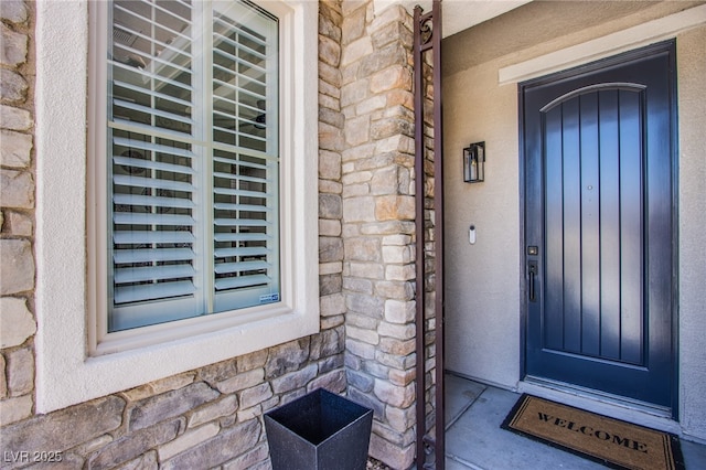 7445 Mezzanine View Ave, Las Vegas, NV 89178 - entrance to property with stone siding