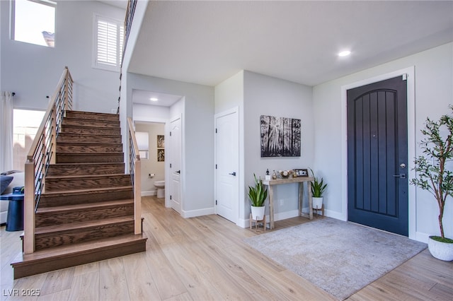 7445 Mezzanine View Ave, Las Vegas, NV 89178 - foyer entrance featuring stairway, light wood-style floors, healthy amount of natural light, and recessed lighting