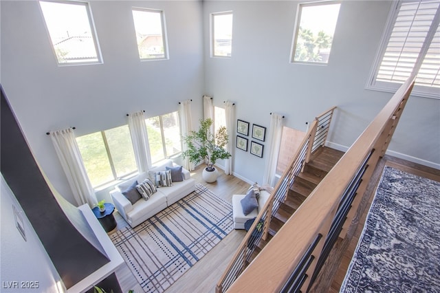 7445 Mezzanine View Ave, Las Vegas, NV 89178 - living area with a high ceiling and wood finished floors