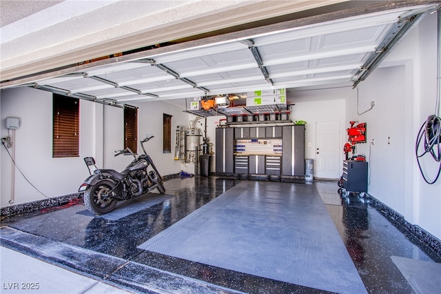7445 Mezzanine View Ave, Las Vegas, NV 89178 - garage with a central vacuum unit and baseboards