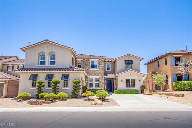 7445 Mezzanine View Ave, Las Vegas, NV 89178 - mediterranean / spanish home with stucco siding, stone siding, and a tiled roof