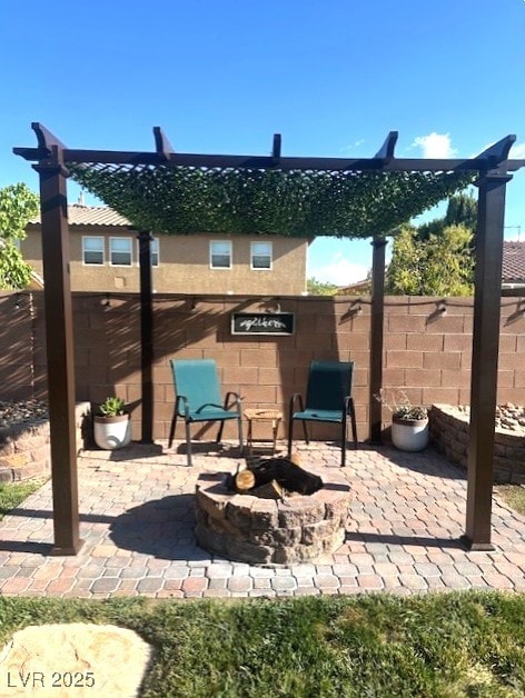 7445 Mezzanine View Ave, Las Vegas, NV 89178 - view of patio / terrace featuring an outdoor fire pit