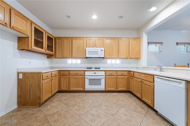 3029 Brownbirds Nest Dr, Henderson, NV 89052 - kitchen with white appliances, light countertops, glass insert cabinets, recessed lighting, and light tile patterned floors