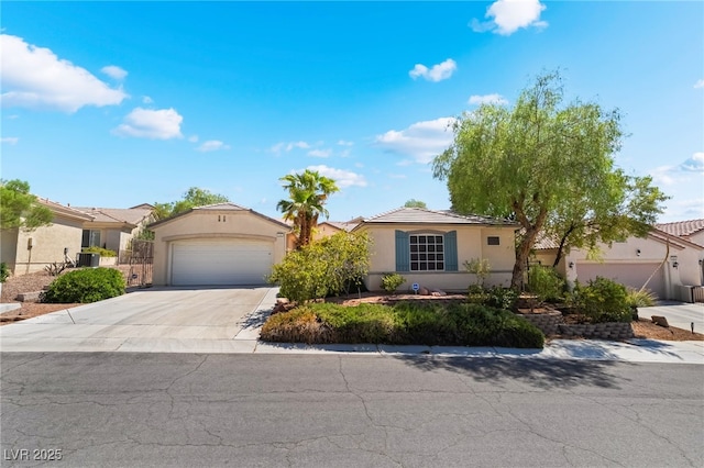 3029 Brownbirds Nest Dr, Henderson, NV 89052 - view of front facade with stucco siding, concrete driveway, an attached garage, and a tile roof