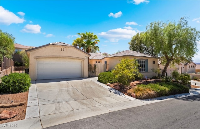 3029 Brownbirds Nest Dr, Henderson, NV 89052 - view of front facade featuring stucco siding, driveway, an attached garage, and a tiled roof