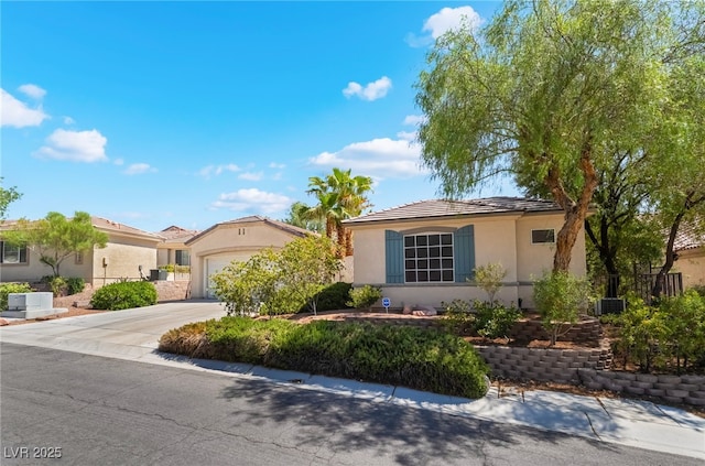 3029 Brownbirds Nest Dr, Henderson, NV 89052 - view of front facade featuring driveway, an attached garage, and stucco siding