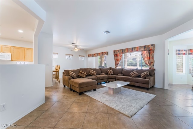 3029 Brownbirds Nest Dr, Henderson, NV 89052 - tiled living area with healthy amount of natural light and ceiling fan