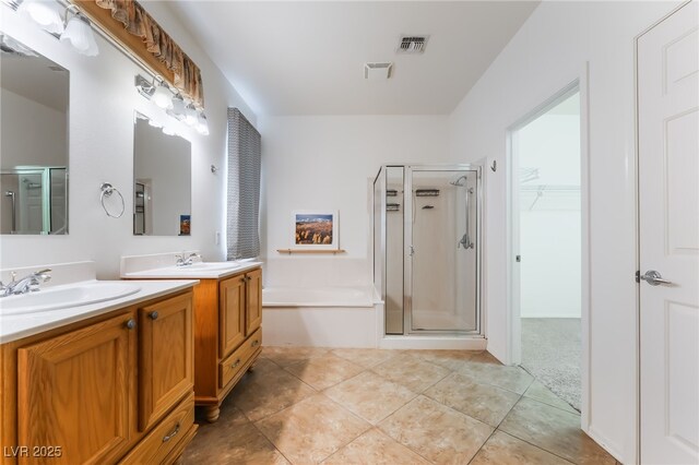 3029 Brownbirds Nest Dr, Henderson, NV 89052 - full bathroom with a shower stall, a garden tub, double vanity, and tile patterned floors