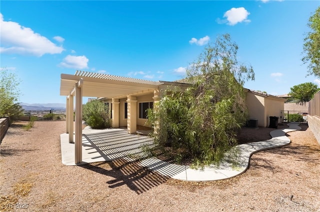 3029 Brownbirds Nest Dr, Henderson, NV 89052 - rear view of property with a pergola, a patio area, and stucco siding