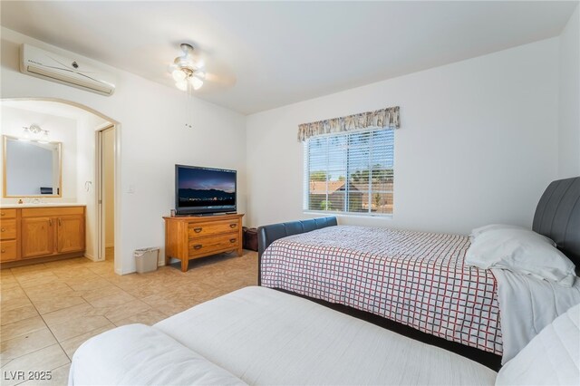 3029 Brownbirds Nest Dr, Henderson, NV 89052 - bedroom featuring a wall unit AC, light tile patterned floors, arched walkways, and a ceiling fan
