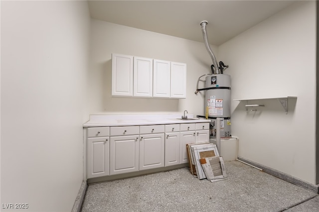 3029 Brownbirds Nest Dr, Henderson, NV 89052 - kitchen with water heater, white cabinets, and light countertops