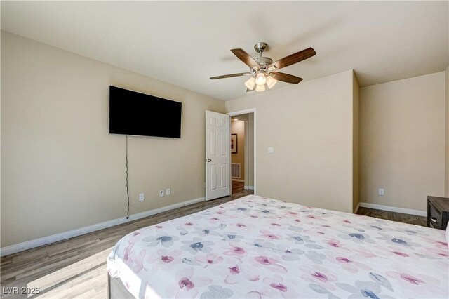 8565 Silver Coast St, Las Vegas, NV 89139 - bedroom with wood finished floors and a ceiling fan