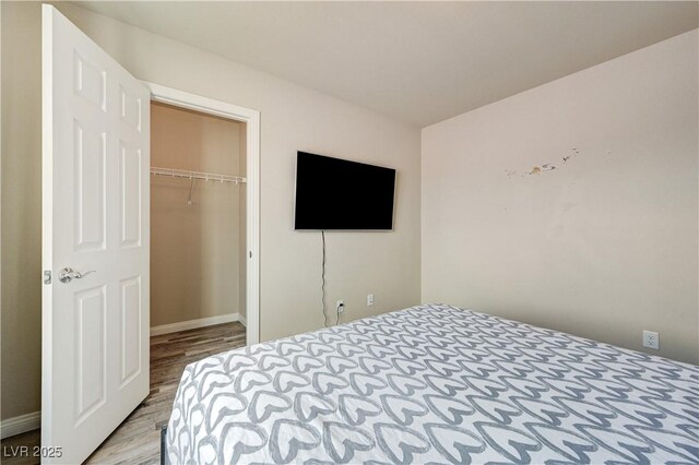 8565 Silver Coast St, Las Vegas, NV 89139 - bedroom with wood finished floors and a closet