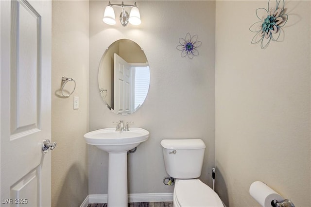 8565 Silver Coast St, Las Vegas, NV 89139 - half bathroom featuring toilet and a sink