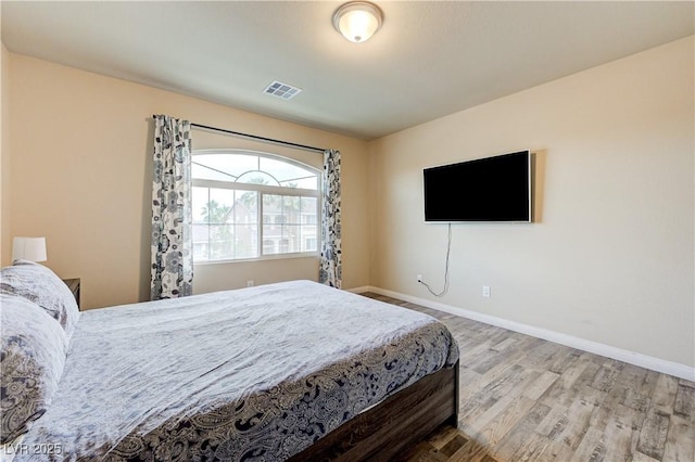 8565 Silver Coast St, Las Vegas, NV 89139 - bedroom with wood finished floors and baseboards