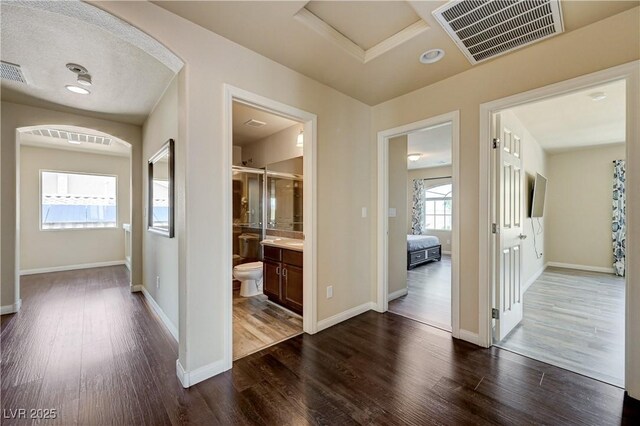 8565 Silver Coast St, Las Vegas, NV 89139 - hallway featuring dark wood-style floors and baseboards