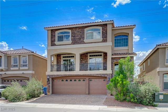 8565 Silver Coast St, Las Vegas, NV 89139 - view of property with stucco siding, stone siding, and an attached garage