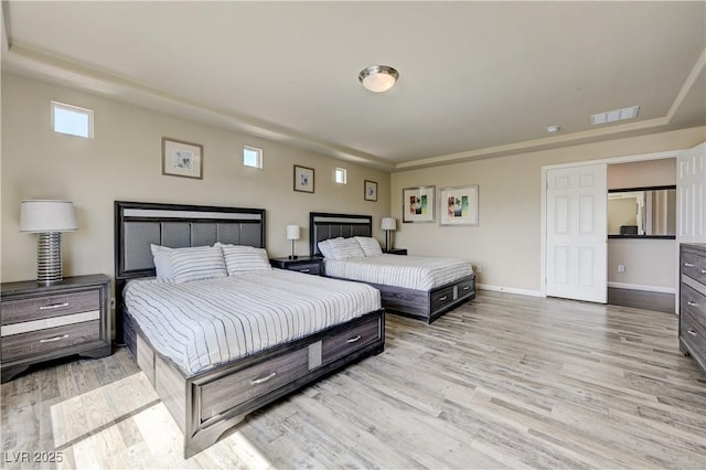 8565 Silver Coast St, Las Vegas, NV 89139 - bedroom with light wood-style flooring and baseboards