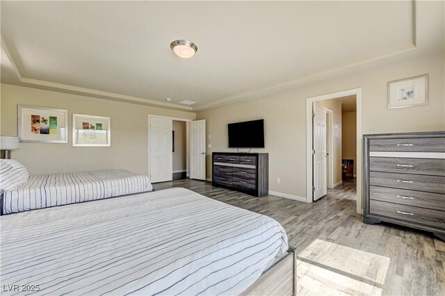 8565 Silver Coast St, Las Vegas, NV 89139 - bedroom featuring wood finished floors and baseboards
