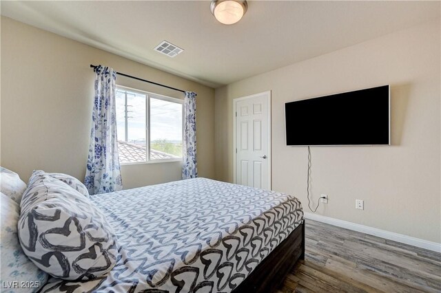 8565 Silver Coast St, Las Vegas, NV 89139 - bedroom featuring wood finished floors and baseboards