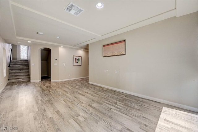 8565 Silver Coast St, Las Vegas, NV 89139 - spare room featuring arched walkways, stairway, light wood-type flooring, and recessed lighting