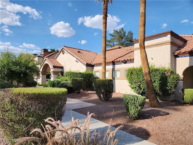 2986 Juniper Hills Blvd Unit 202, Las Vegas, NV 89142 - view of side of home with stucco siding and a tile roof