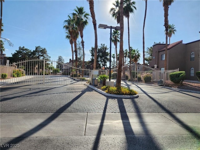 2986 Juniper Hills Blvd Unit 202, Las Vegas, NV 89142 - view of road featuring a gate, a gated entry, curbs, and a residential view