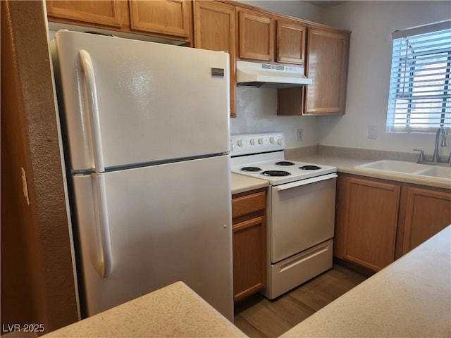 2986 Juniper Hills Blvd Unit 202, Las Vegas, NV 89142 - kitchen featuring freestanding refrigerator, under cabinet range hood, white electric range oven, light countertops, and wood finished floors