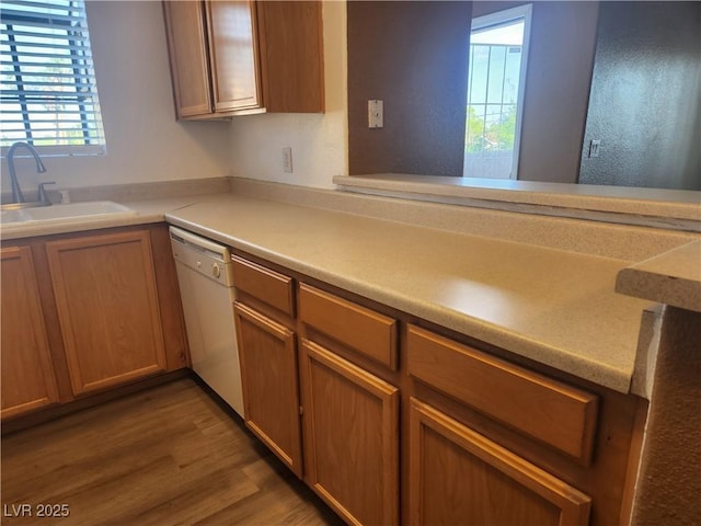 2986 Juniper Hills Blvd Unit 202, Las Vegas, NV 89142 - kitchen with dishwasher, wood finished floors, and light countertops