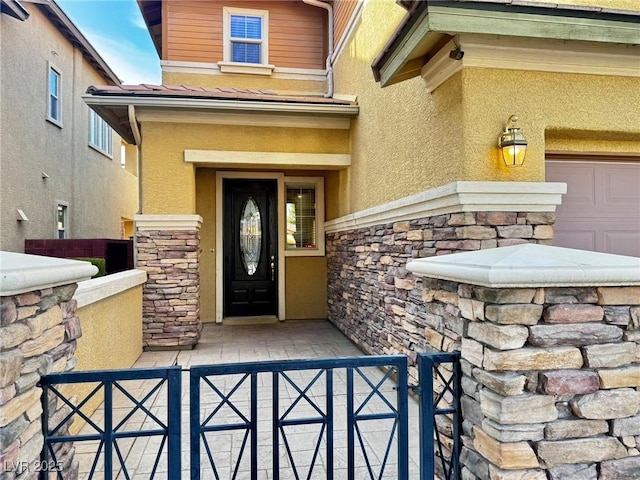 5361 Candlespice Way, Las Vegas, NV 89135 - doorway to property featuring stucco siding and stone siding