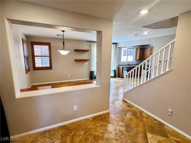 5361 Candlespice Way, Las Vegas, NV 89135 - hallway featuring baseboards and stairway