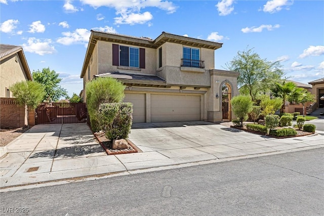 3405 Brook Song Ave, North Las Vegas, NV 89081 - view of front of home featuring an attached garage, a gate, concrete driveway, and stucco siding