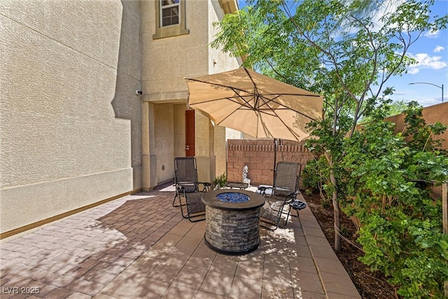 3405 Brook Song Ave, North Las Vegas, NV 89081 - view of patio with an outdoor fire pit