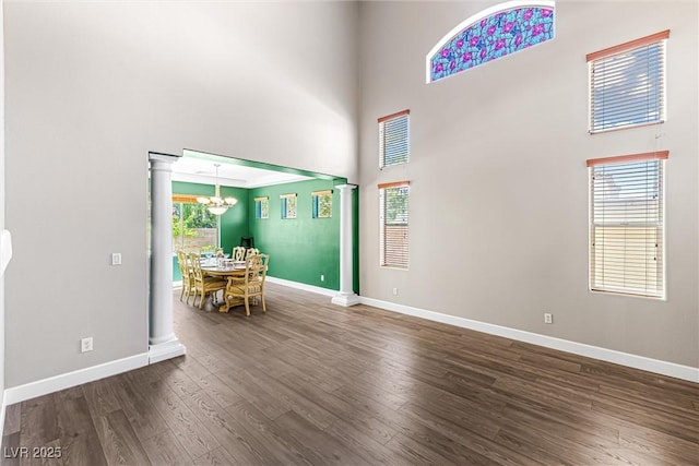 3405 Brook Song Ave, North Las Vegas, NV 89081 - dining space featuring a chandelier, a high ceiling, wood finished floors, and healthy amount of natural light
