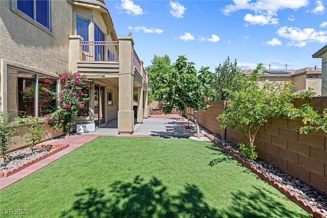 3405 Brook Song Ave, North Las Vegas, NV 89081 - fenced backyard with a balcony and a patio area