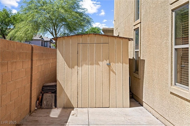 3405 Brook Song Ave, North Las Vegas, NV 89081 - fenced backyard with a storage unit