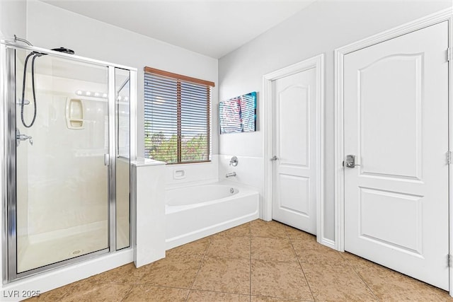 3405 Brook Song Ave, North Las Vegas, NV 89081 - bathroom with tile patterned floors, a shower stall, and a bath