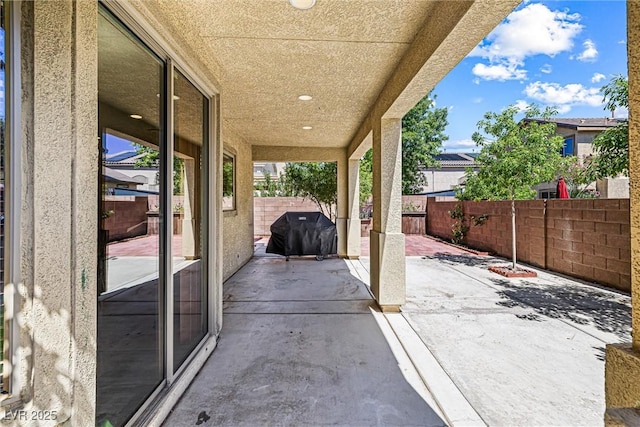3405 Brook Song Ave, North Las Vegas, NV 89081 - fenced backyard with a patio and a grill