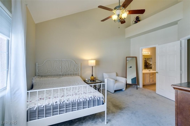 2925 Wigwam Pkwy Unit 1124, Henderson, NV 89074 - bedroom featuring high vaulted ceiling, light colored carpet, ensuite bath, and a ceiling fan
