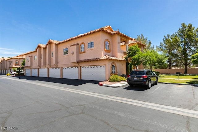 2925 Wigwam Pkwy Unit 1124, Henderson, NV 89074 - mediterranean / spanish home featuring a tile roof and stucco siding