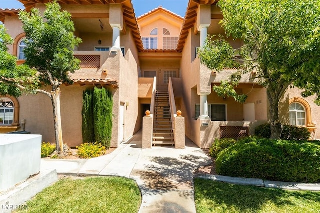 2925 Wigwam Pkwy Unit 1124, Henderson, NV 89074 - mediterranean / spanish-style home featuring stairway, stucco siding, and a tile roof