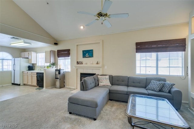 2925 Wigwam Pkwy Unit 1124, Henderson, NV 89074 - living area featuring ceiling fan, a tile fireplace, lofted ceiling, and light carpet