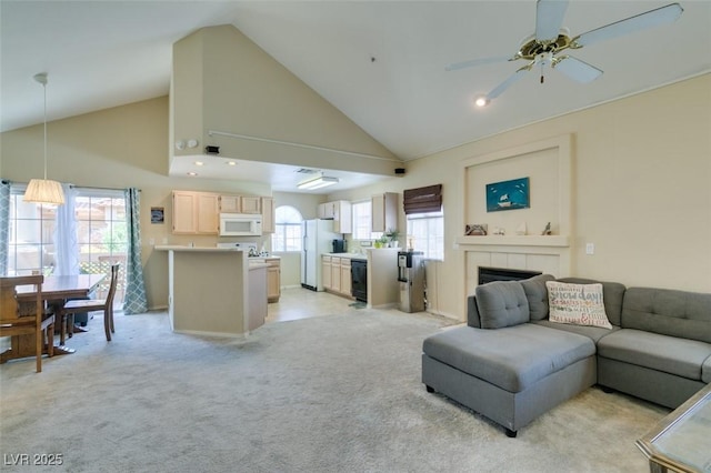 2925 Wigwam Pkwy Unit 1124, Henderson, NV 89074 - living room featuring ceiling fan, high vaulted ceiling, plenty of natural light, light carpet, and a tile fireplace