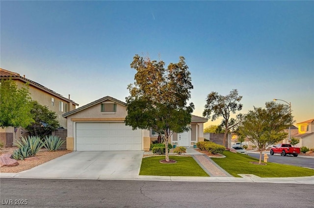 528 Lavina Ct, Las Vegas, NV 89123 - obstructed view of property featuring driveway, a front lawn, stucco siding, and an attached garage